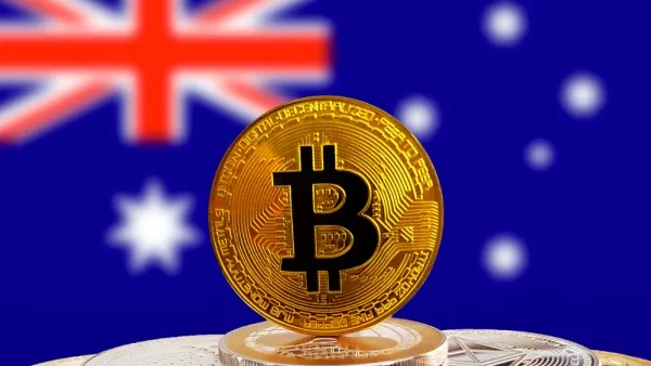 A bitcoin coin in front of the Australian flag