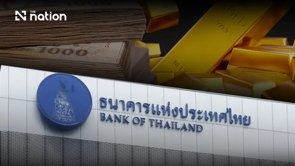 The Bank of Thailand sign beside gold bars