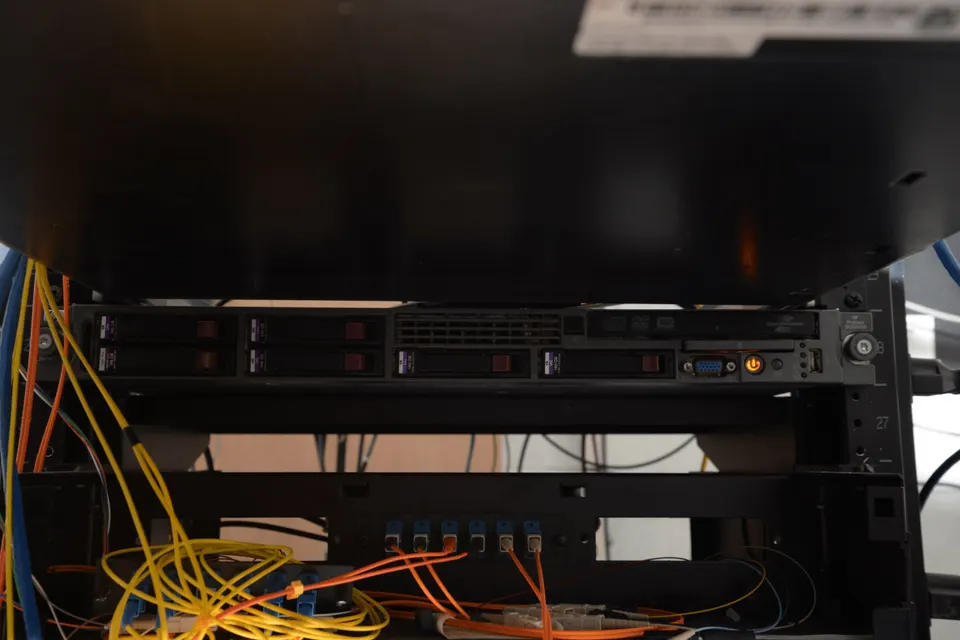 Server rack in a low-lit data centre